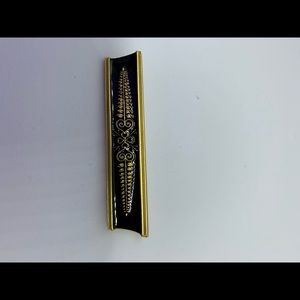 Gold and black broach